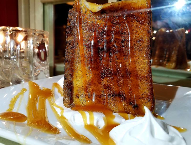 The 1776 Steakhouse cheesecake brûlée arrived looking like the monolith from 2001 Space Odyssey. BOB YESBEK PHOTO